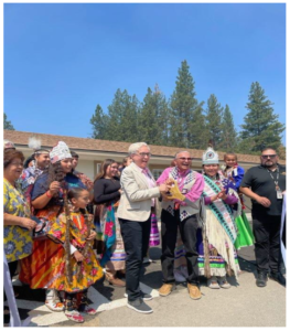 Oregon Governor Tina Kotek holds scissors with Klamath Tribal Chairman William Ray Jr. prior to Melita’s Ribbon-Cutting Ceremony.